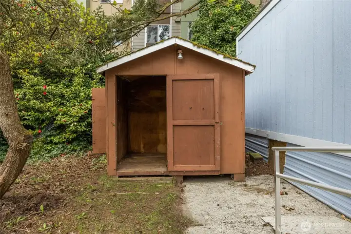 Handy storage shed - perfect for tools, bikes, or all the extras.