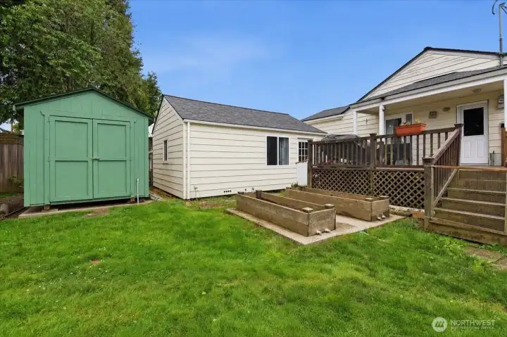 Back yard showing storage shed, bonus room building and back of house Back yard showing storage shed, bonus room building and back of house