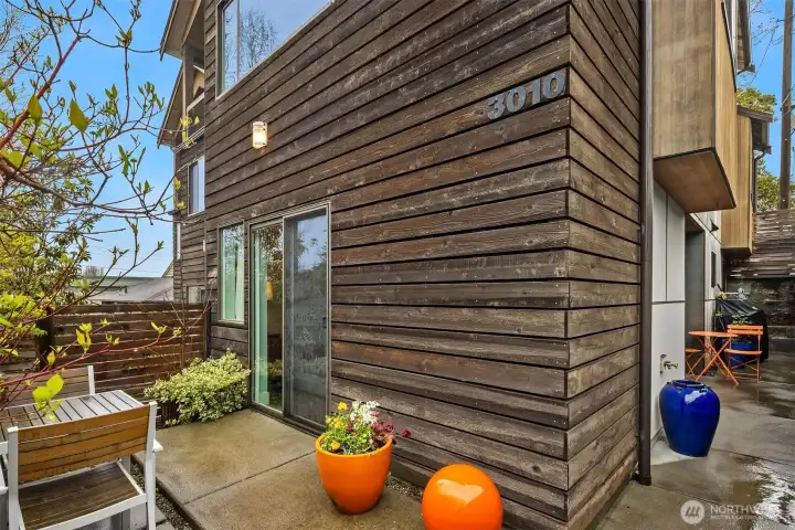 Charming patio with vegitation for privacy. Charming patio with vegitation for privacy.