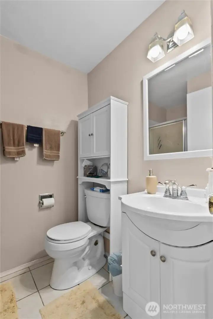 Convenient primary bath includes an updated vanity, generous storage, and a functional layout. Convenient primary bath includes an updated vanity, generous storage, and a functional layout.