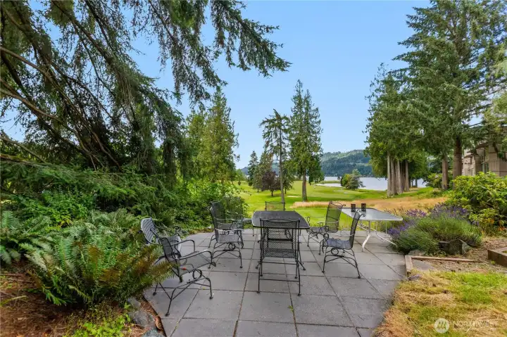 Enjoy a spacious community patio with views toward the golf course and Lake Whatcom, creating an inviting space for outdoor gatherings. Enjoy a spacious community patio with views toward the golf course and Lake Whatcom, creating an inviting space for outdoor gatherings.