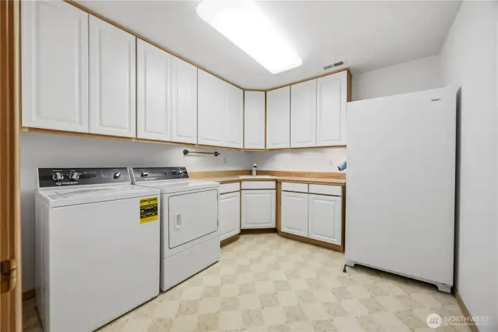 Laundry with tons of cabinets Laundry with tons of cabinets