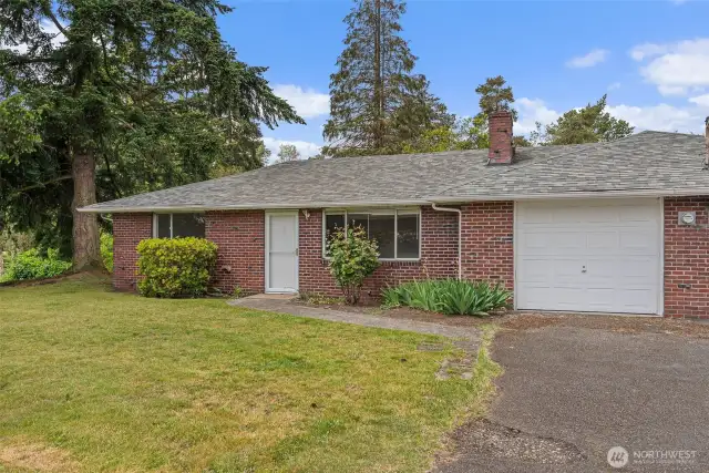 Example of one of the four units. Each unit has two bedrooms, 1 bath and a one car attached garage. Inside entry from the garage to the kitchen area.