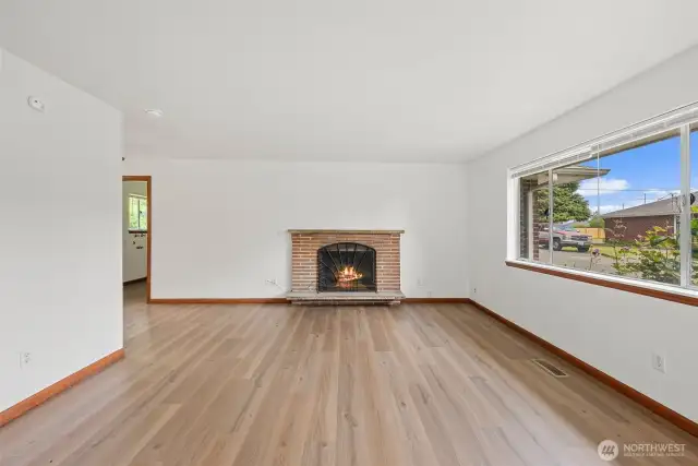 The floor plans in each unit are identical. Here is the living room in one of the units. Wood burning fireplace in each unit.