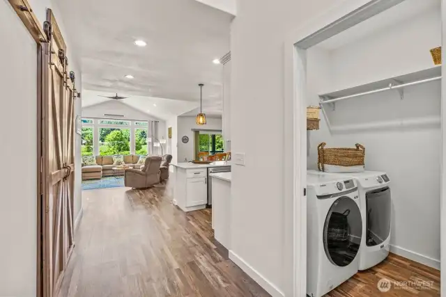 Laundry closet to the right and gorgeous barn doors to the left that open to large pantry/storage...