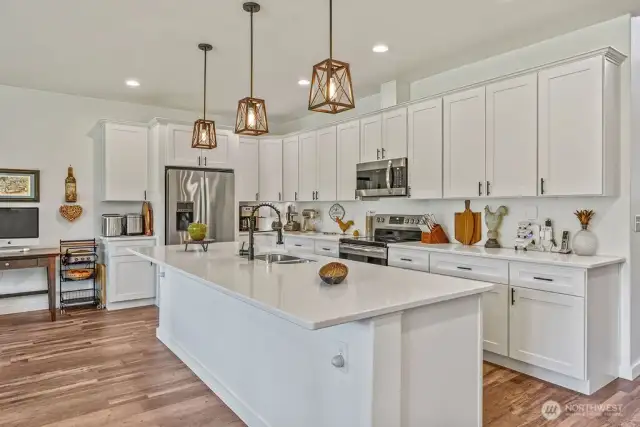 You really have to see it to believe it, it's longer than appears in photos....this island is sure to please!  The gorgeous flooring continues into the kitchen, dining, great room and all the rest of the living space.