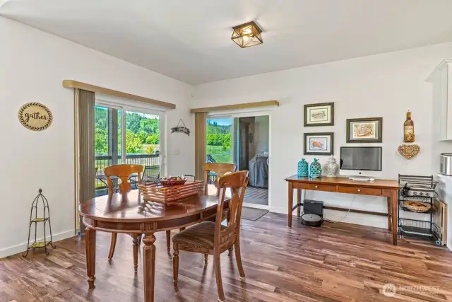 View of spacious dining area with dual sliders - spy that outdoor grilling area?  You'll enjoy the well-thought-out placement of the grill just off kitchen/dining.