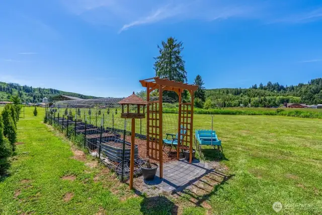 Bird house, arbor,  deer protection, pavered entrance, mulch paths and raised bets, simply bring the plants!