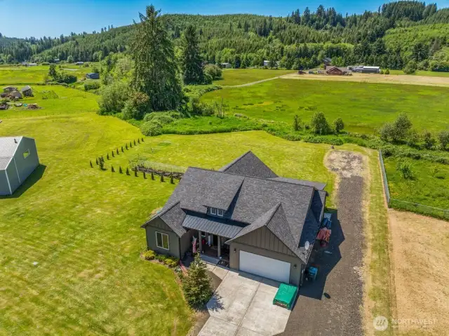 Birdseye view of this lovely acre with creek along the west boundary and peaceful territorial views.