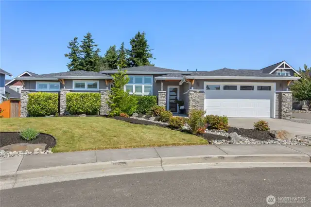 Welcome to 6072 Monument Drive!  Lots of windows with an elegant entrance.