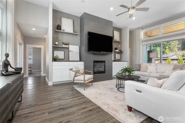 Tiled fireplace from floor to 12 foot ceiling makes this home feel grand!