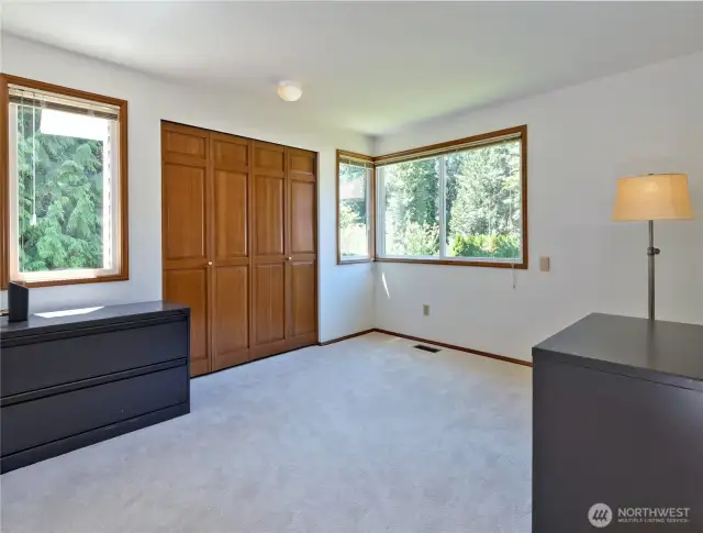 2nd bedroom with both side windows to draw more light. You can see lush landscapes & shrubs etc.