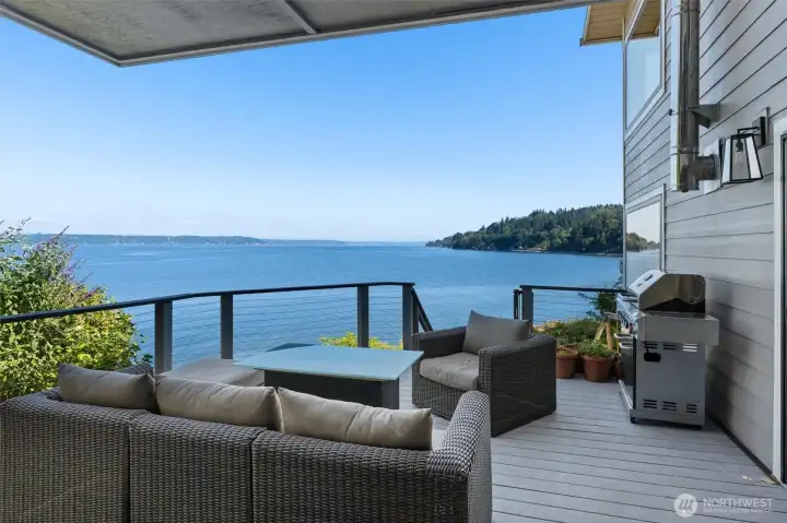 The entertaining size deck on the main floor with steps to the play area and down to beach. The views of Mount Rainier will blow your mind!