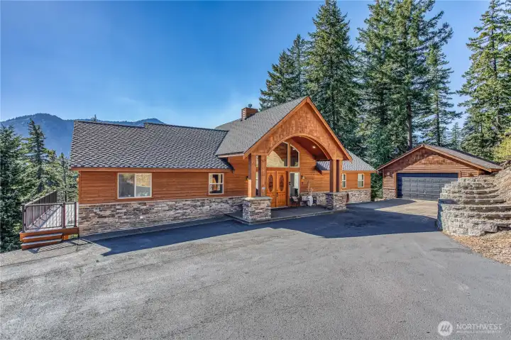 Paved entry, gated driveway, garage