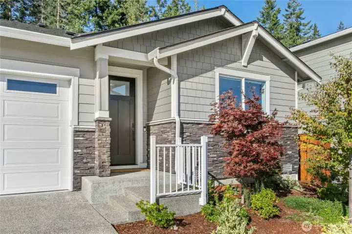 The professionally landscaped front yard is easy-care and drought tolerant.