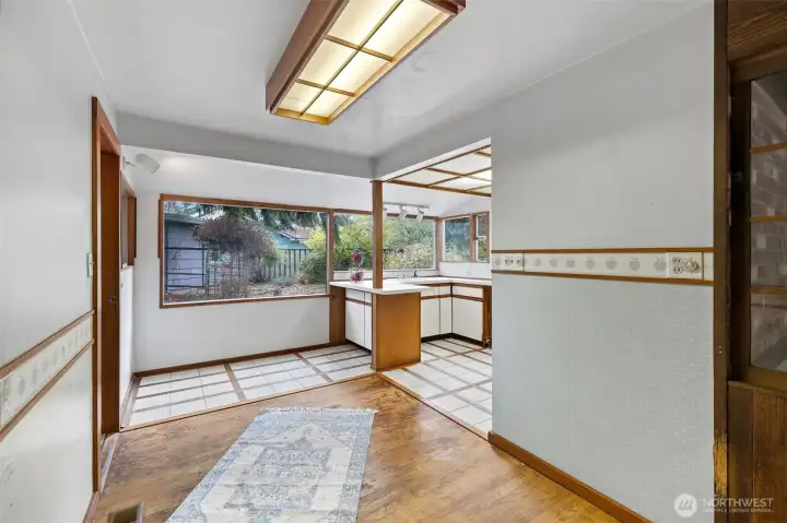 Dining area with kitchen on right