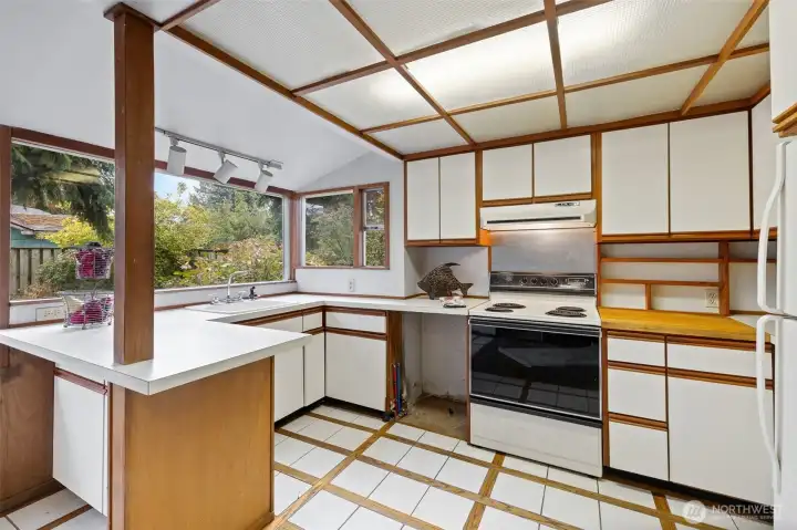 Kitchen with area for barstools on left