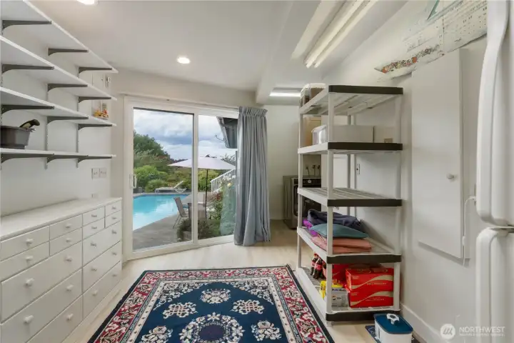 Huge mudroom/laundry room with a bathroom (with shower) when you come out of the pool!