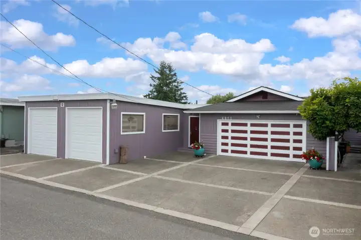 2 car gararage PLUS the 2 large RV garages measuring 23.5' x 11' each.  PLUS on more off street parking to the side for the ADU