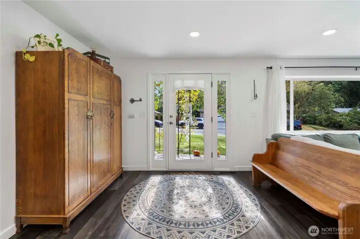 Entry that opens to kitchen, dining and living room