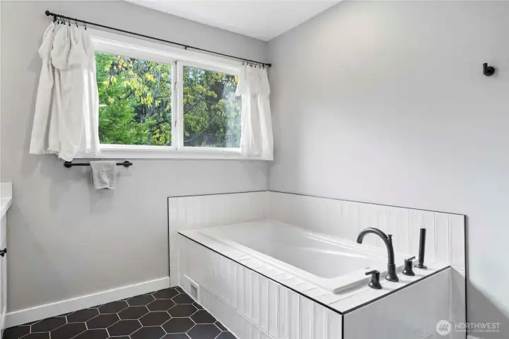 large bathtub in primary ensuite
