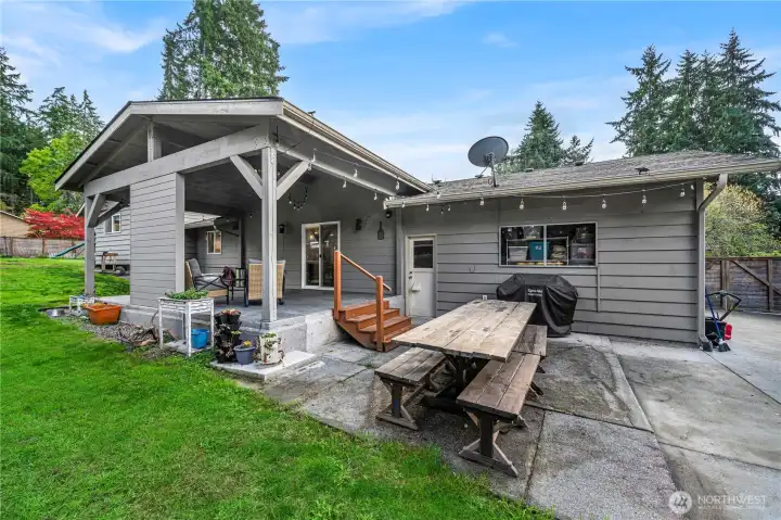 Back view of house with patios