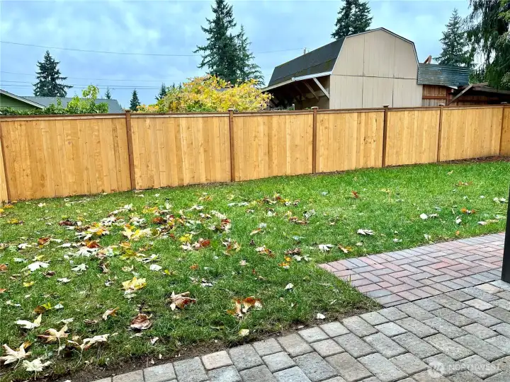 Spacious backyard with a new fence for add privacy.