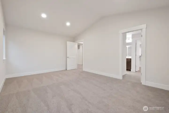 Primary suite with vaulted ceilings