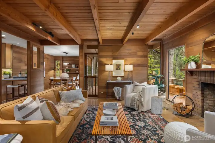 All on one-level, you will appreciate the flow from room to room. Inside, rich tongue and groove cedar walls and abundant floor to ceiling windows, bring the outdoors in.