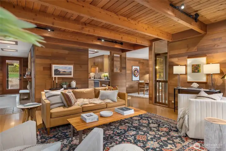 A covered porch and glass door at left offers a welcoming entry for guest as they enter the warm foyer and move towards the main living areas, the efficient kitchen at back and dining room with thoughtful pass-through is on your right.