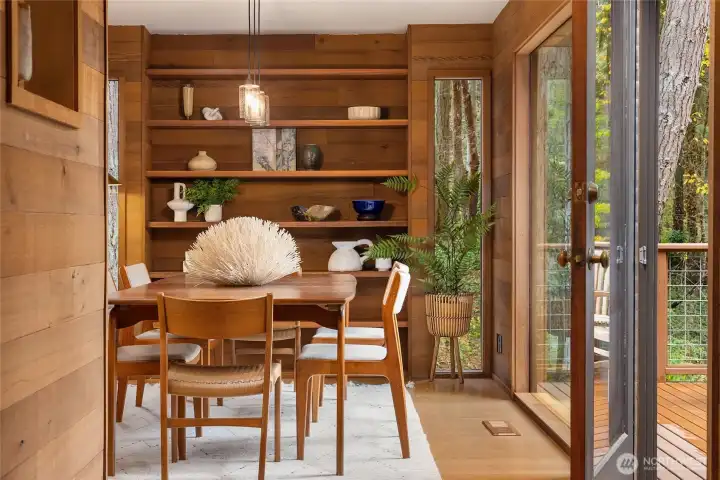 The Dining Room offers large windows and built-ins. Spilling out to the sunny south facing deck for evening barbeques.