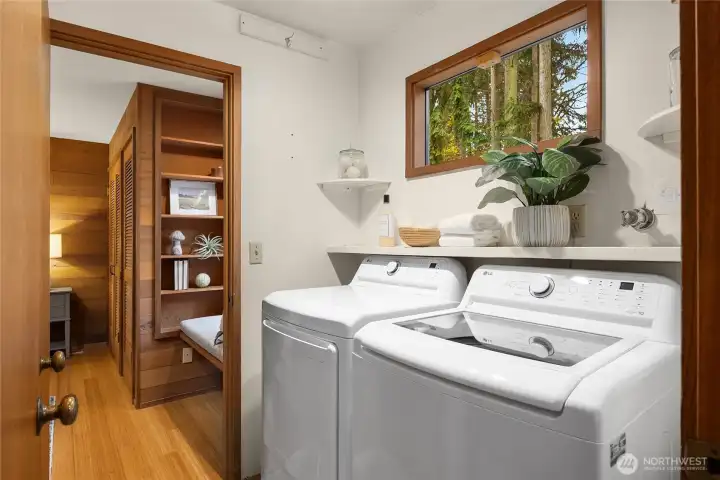 Convenient walk-through laundry room is nestled between bedrooms#2 & #3.
