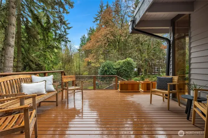 The deck overlooks the grounds with easy backyard access.