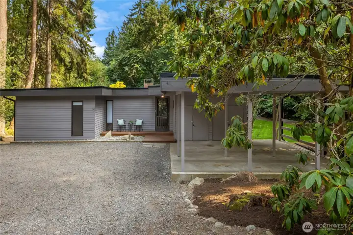 Tucked away from Manitou Drive enter the drive towards the welcoming circular drive, covered 2-car carport and abundance of parking for guests.