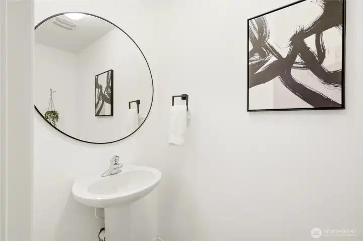 Spacious main-level half bath for guests and everyday convenience