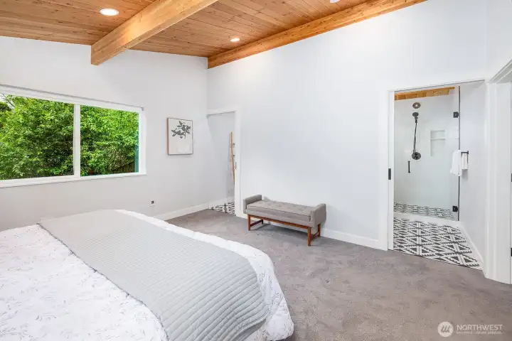 A view of the primary bedroom ensuite looking towards the dual entrance spa style bathroom.