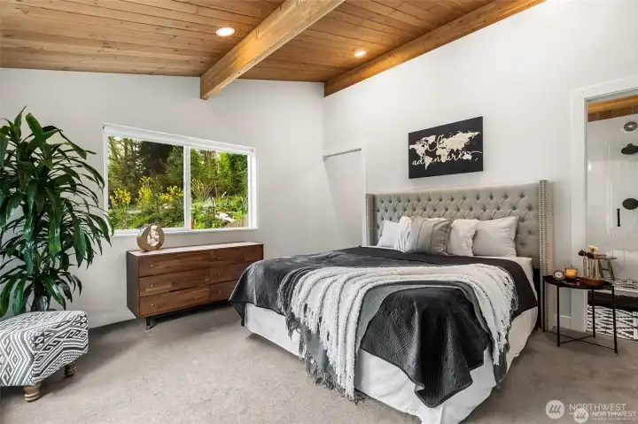 Another view of bed postion in primary ensuite (virtually staged)