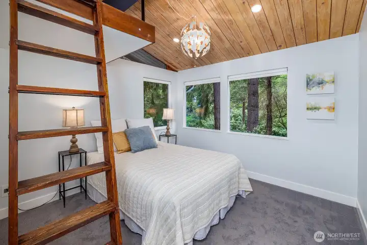This cool loft bedroom will be fought over!Great bedroom with ladder to a sweet little loft area with it's own lighting.  Exposed wood beams, oversized closet and fun lights!