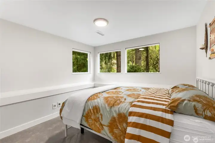 Virtually staged - one of two lower level bedrooms.