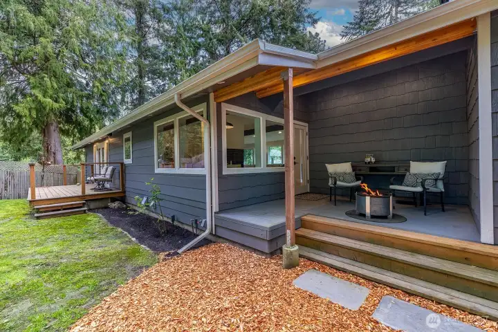 A view of the covered back porch and the private deck off of the second ensuite.  All new paint 2013 and extremely well maintained home.