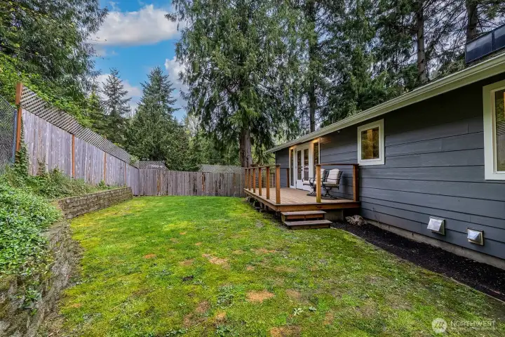 A better view of the length and depth of the back yard space. Property line goes slightly beyond the back fence.