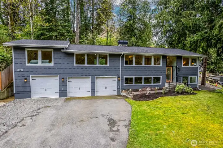 Lot's of bright exterior lighting really showcases this mid mod masterpiece.  Large front yard for anything you desire and the entire area is serviced by a sprinkler system.