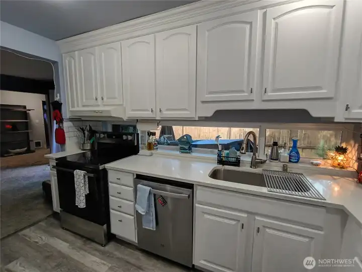 Kitchen with new appliances and granite countertiops