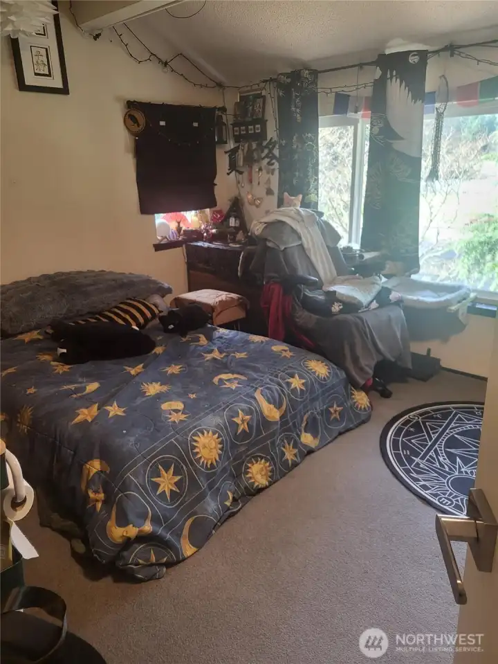 One of 4 bedrooms, overlooks the private patio and garden space.