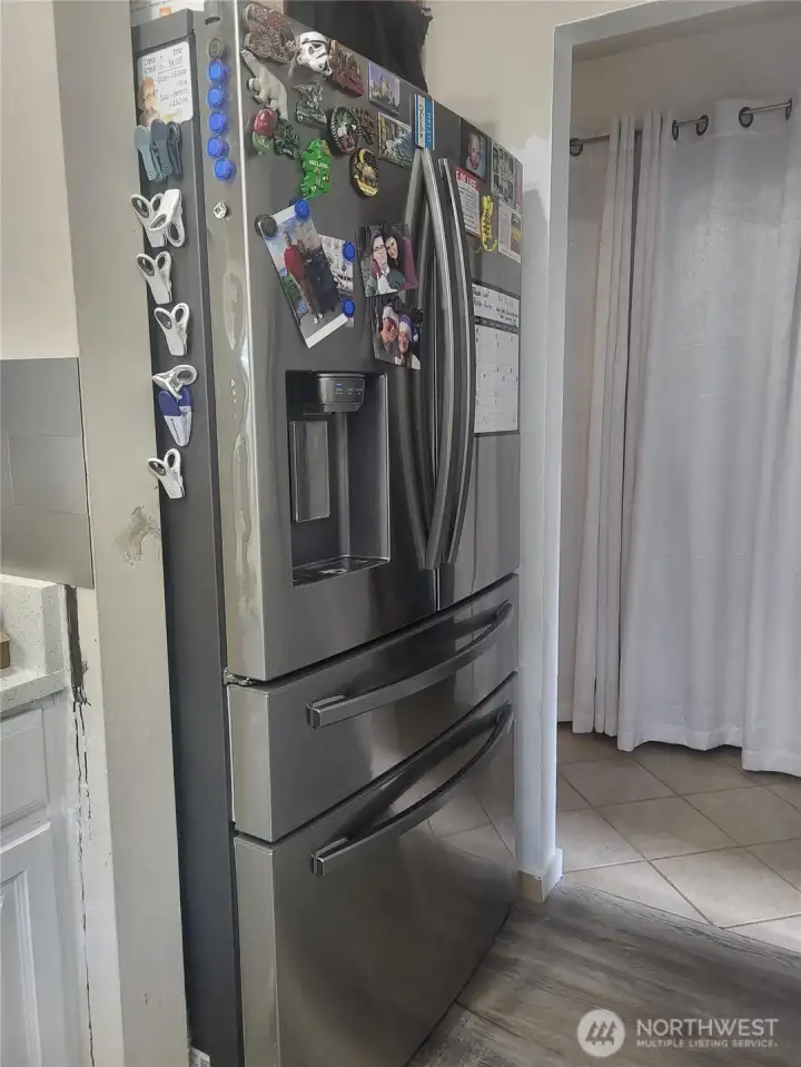 Large fridge with ice and water.