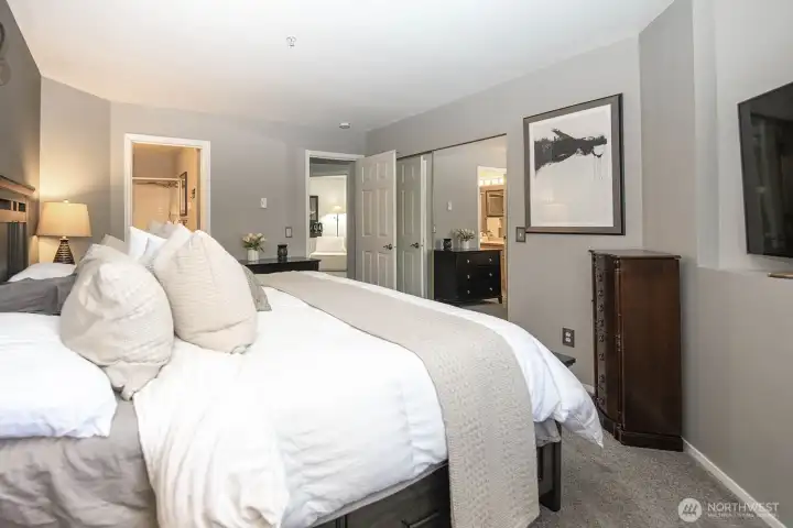 Primary bedroom looking toward entry to primary bath and hallway