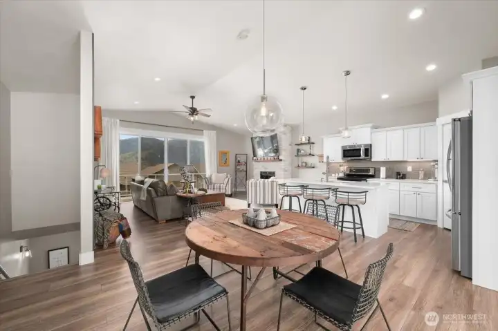 The main level has an open layout that connects the kitchen, dining, and gathering areas.