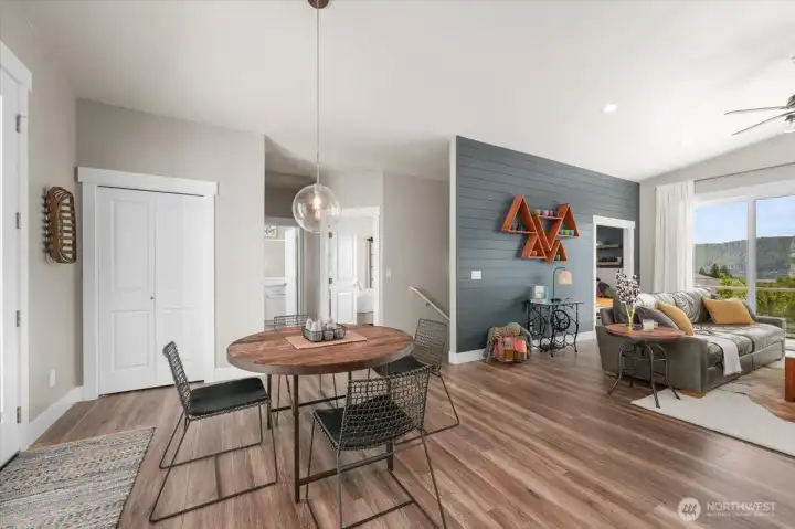 Main floor dining area with adjacent patio access, creating an easy connection between indoor dining and outdoor cooking or entertaining.