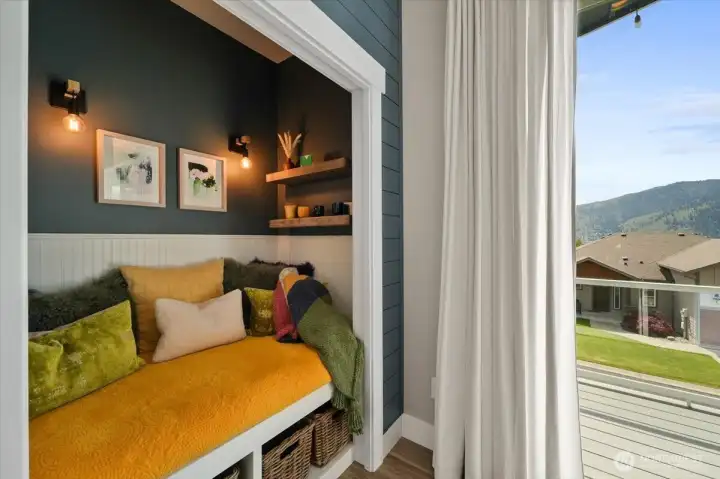 The cutest nook tucked just off the main living space, creating a cozy place to read, relax, or enjoy the surrounding views.