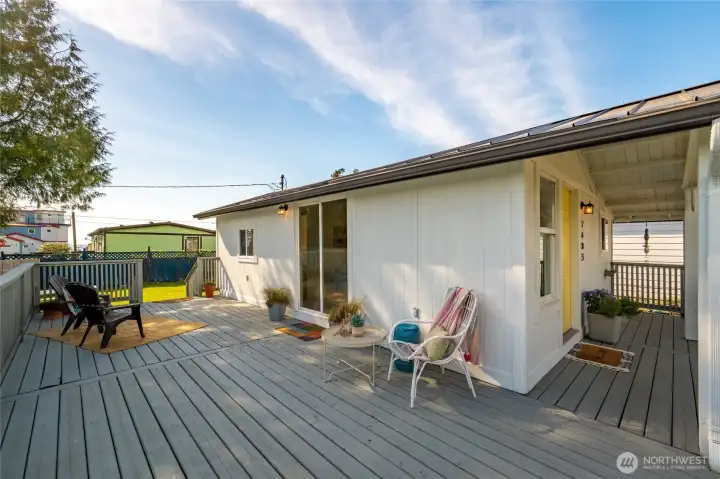 Expansive wraparound deck offers multiple seating areas and seamless indoor-outdoor flow, ideal for entertaining or relaxing in the fresh Pacific Northwest air.
